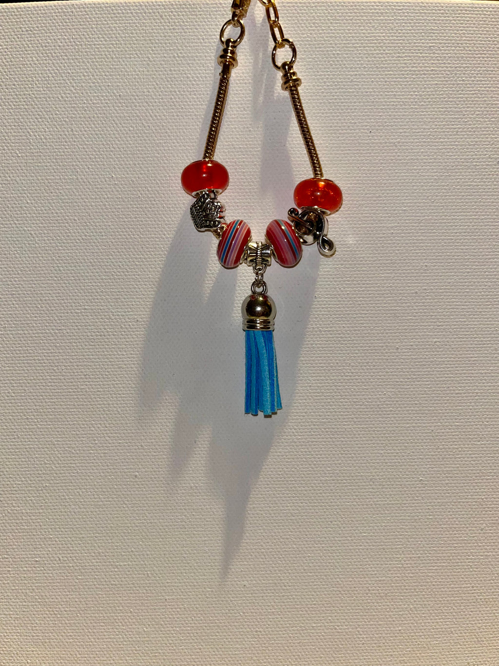 Gold-Tone Snake Chain Charm Bracelet w/Red & Blue Accents, Music Note & Crown
