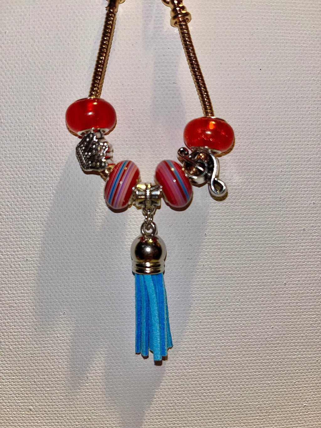 Gold-Tone Snake Chain Charm Bracelet w/Red & Blue Accents, Music Note & Crown