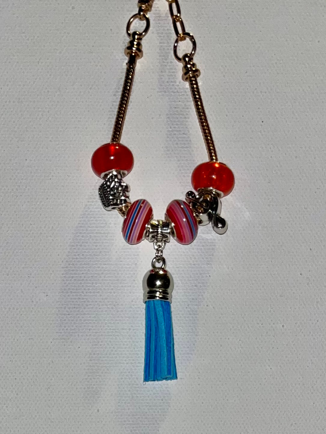 Gold-Tone Snake Chain Charm Bracelet w/Red & Blue Accents, Music Note & Crown