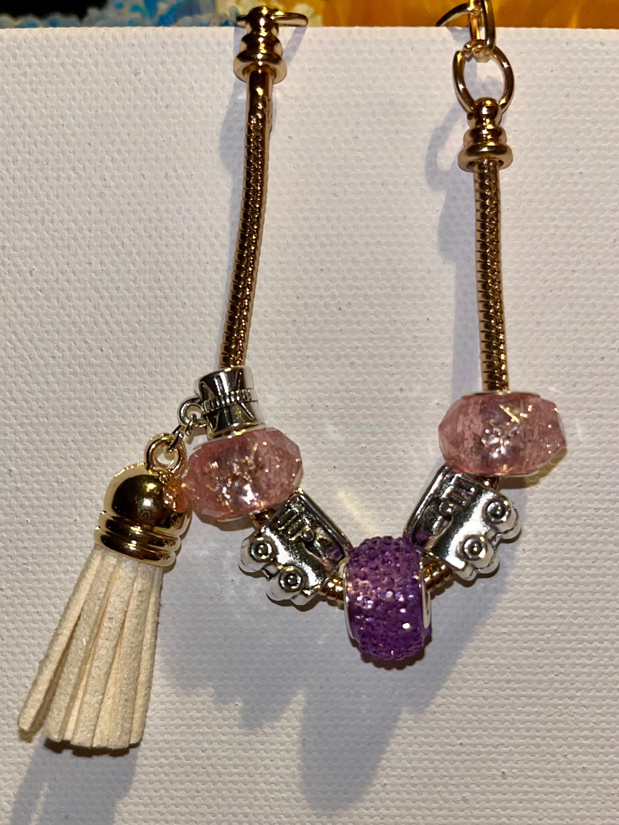 Gold-Tone Snake Chain Bracelet w/Pink & Purple Beads, Cream Tassel & Train Charm