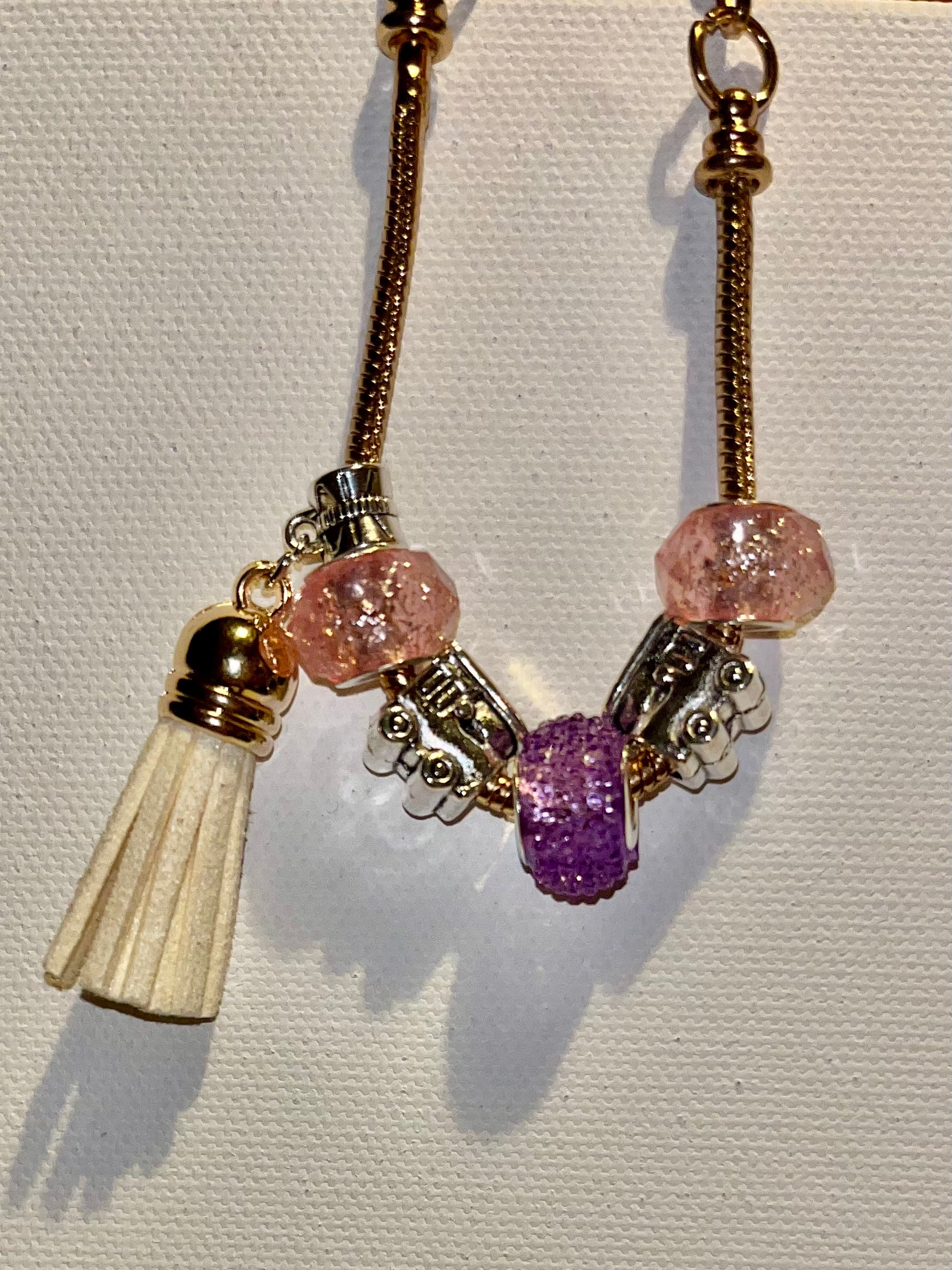Gold-Tone Snake Chain Bracelet w/Pink & Purple Beads, Cream Tassel & Train Charm