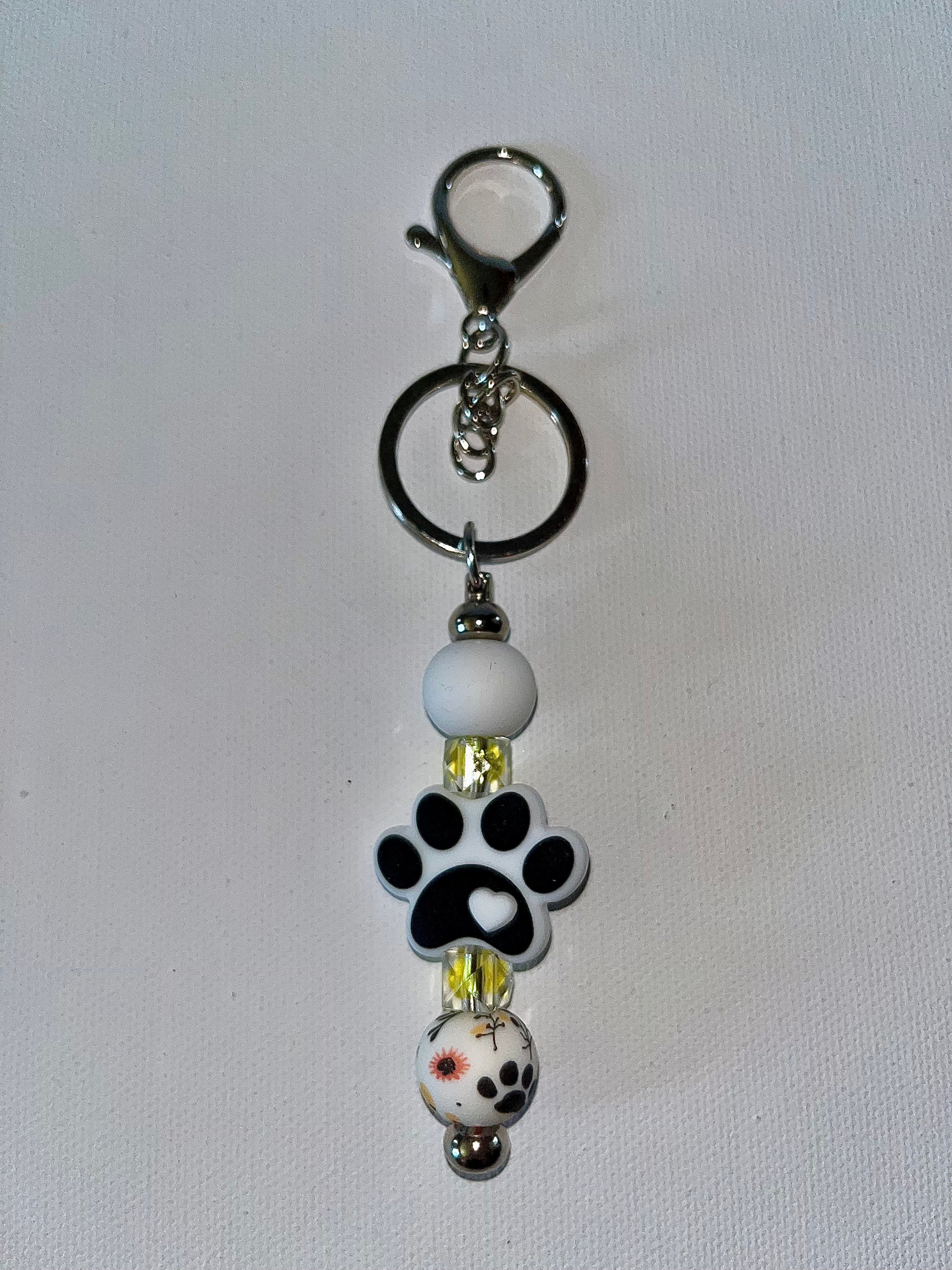 White & Black Paw Print Beaded Keychain w/Yellow & Orange Accents