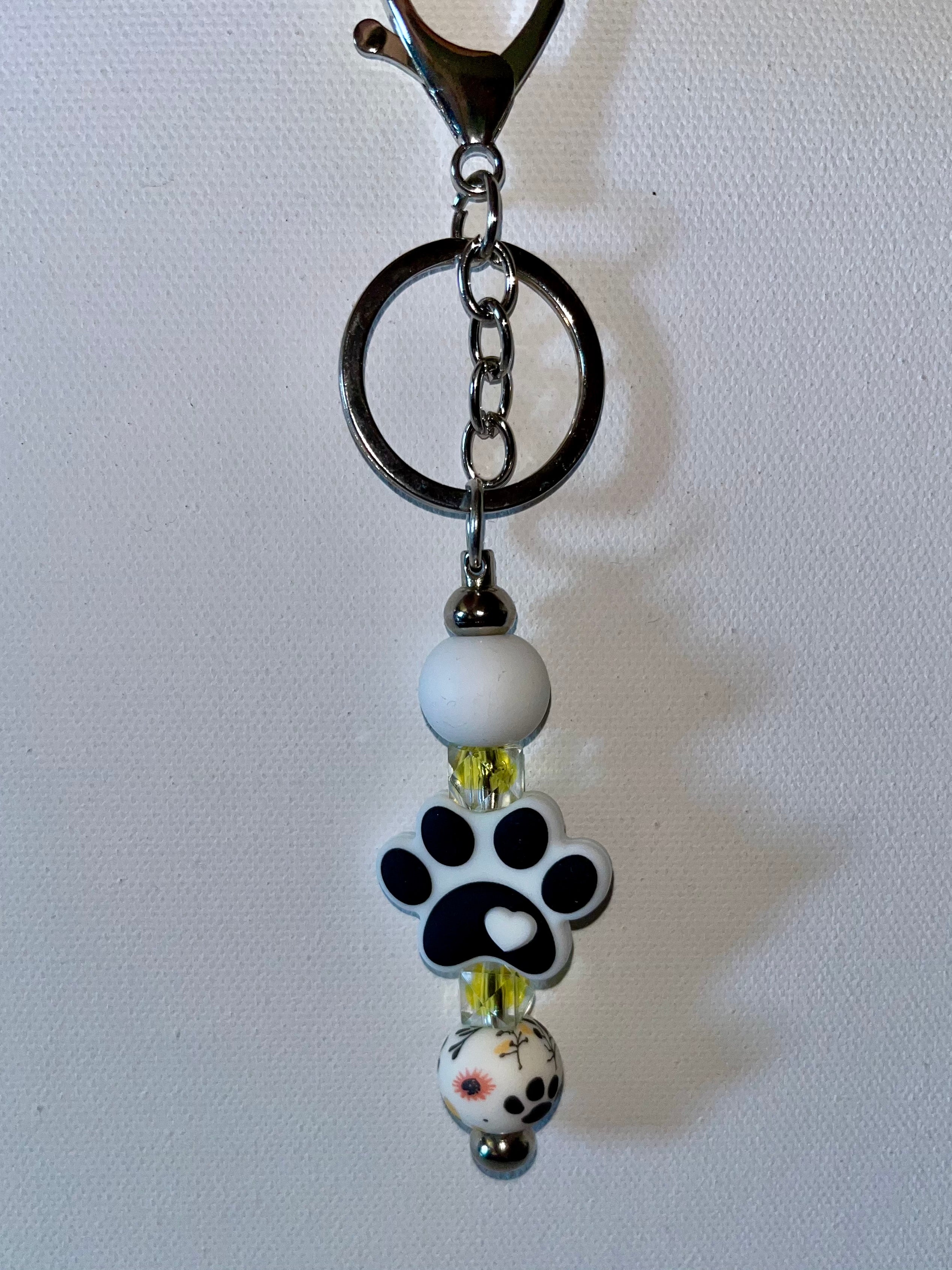White & Black Paw Print Beaded Keychain w/Yellow & Orange Accents