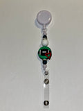 White Badge Reel w/Football Charm & Red Heart, Black, Green & Rhinestone Accents