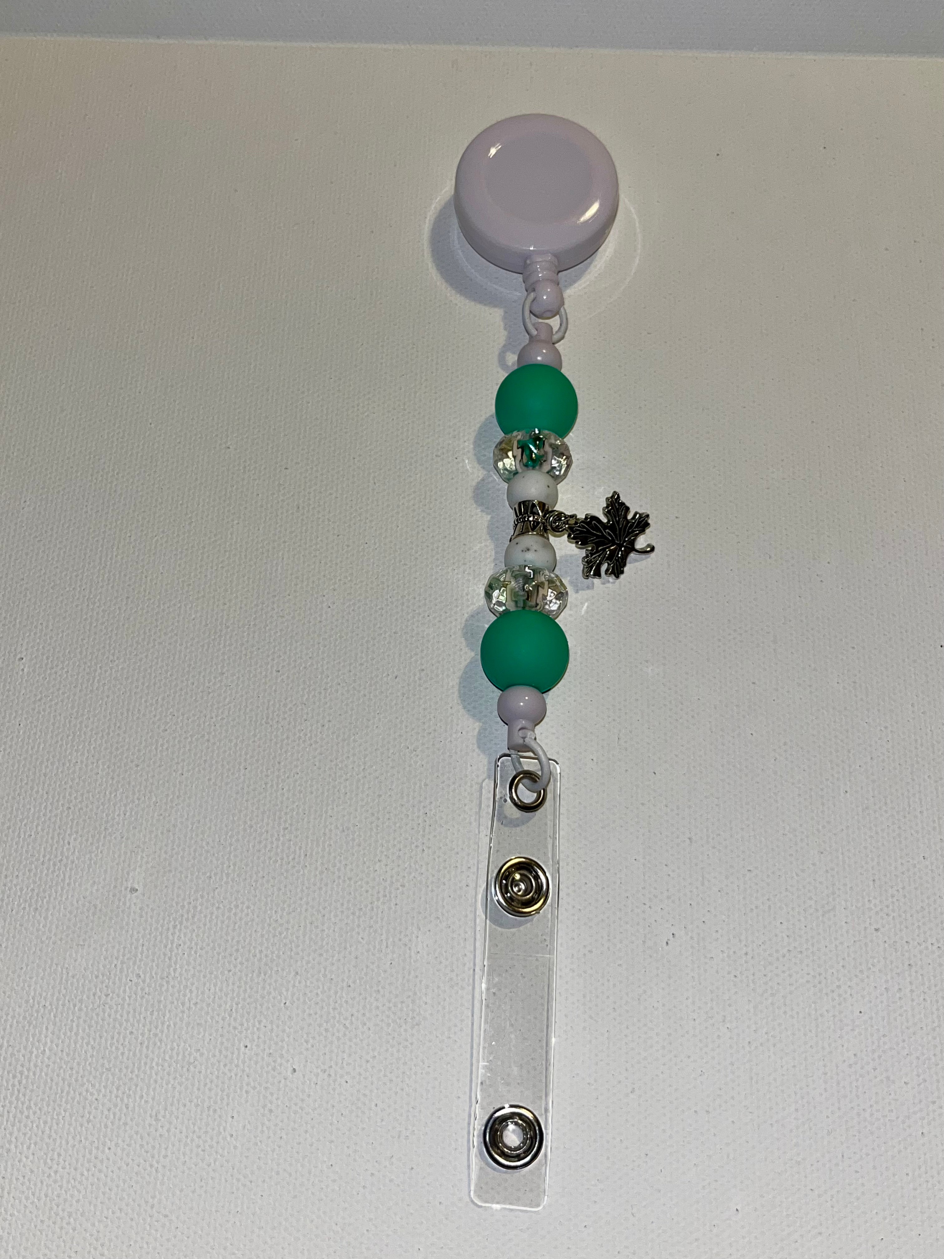 Retractable Green, White & Silver Beaded White Badge Reel w/Silver Leaf Charm