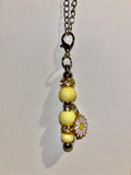 Yellow Beaded Cup Charm w/Gold & Rhinestone Accents & White Dangly Daisy Charm