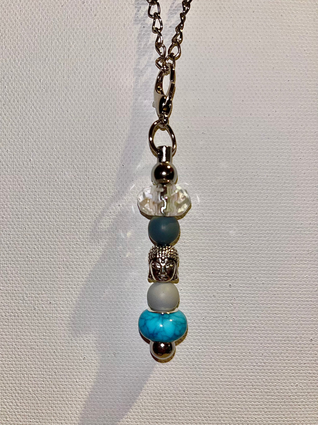 onyxcollective onyxcollective Updated 7 hours ago Silver-Tone Buddha Cup Charm w/Turquoise, Gray, Crystal & Slate Blue Beads