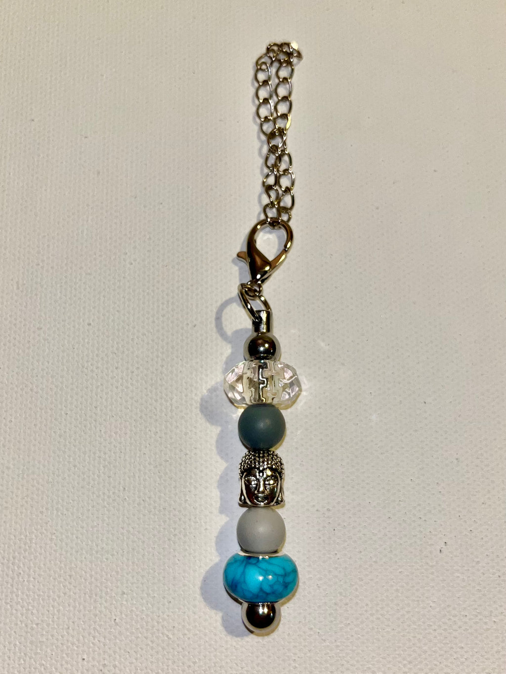 onyxcollective onyxcollective Updated 7 hours ago Silver-Tone Buddha Cup Charm w/Turquoise, Gray, Crystal & Slate Blue Beads