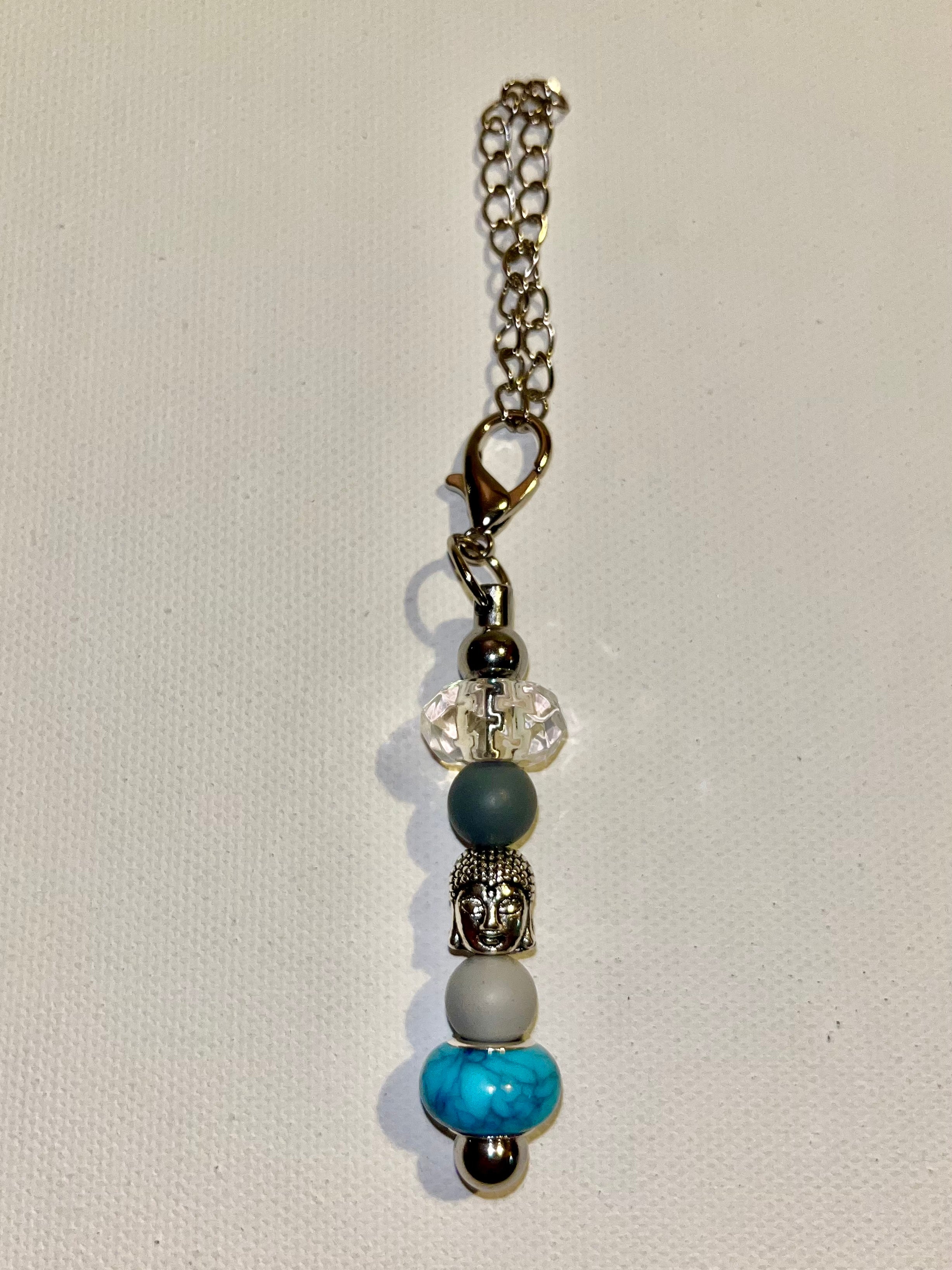 onyxcollective onyxcollective Updated 7 hours ago Silver-Tone Buddha Cup Charm w/Turquoise, Gray, Crystal & Slate Blue Beads