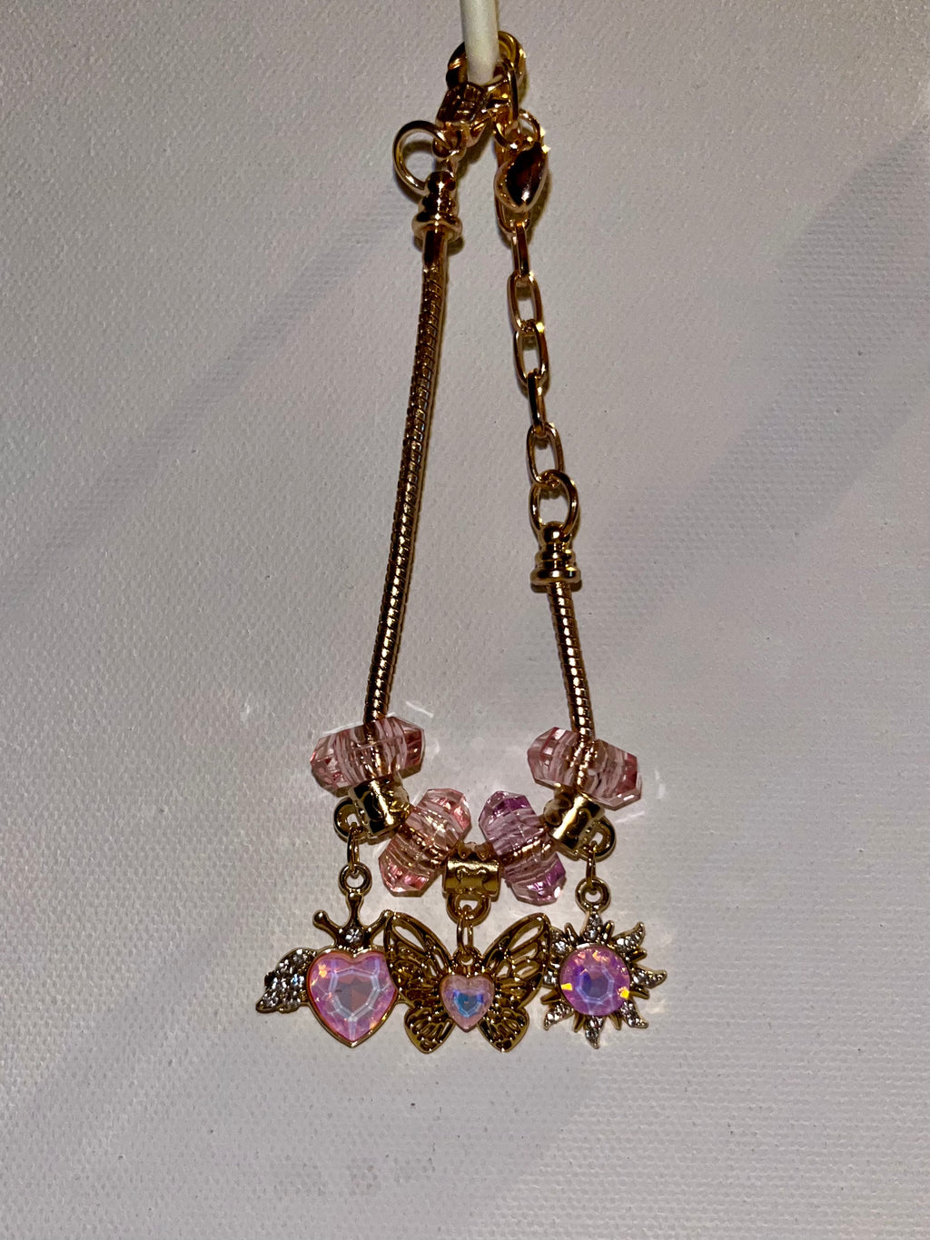 Gold-Tone Pink Crystal Charm Bracelet with Butterfly, Heart & Sun Charms