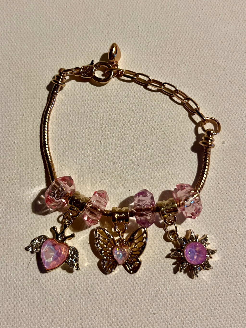 Gold-Tone Pink Crystal Charm Bracelet with Butterfly, Heart & Sun Charms