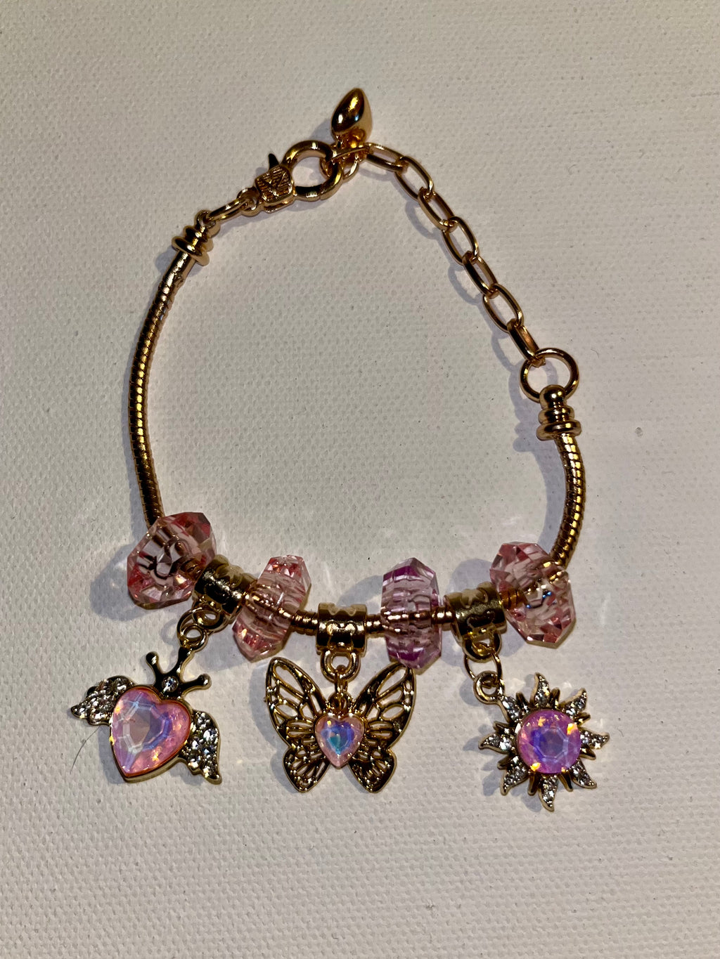 Gold-Tone Pink Crystal Charm Bracelet with Butterfly, Heart & Sun Charms