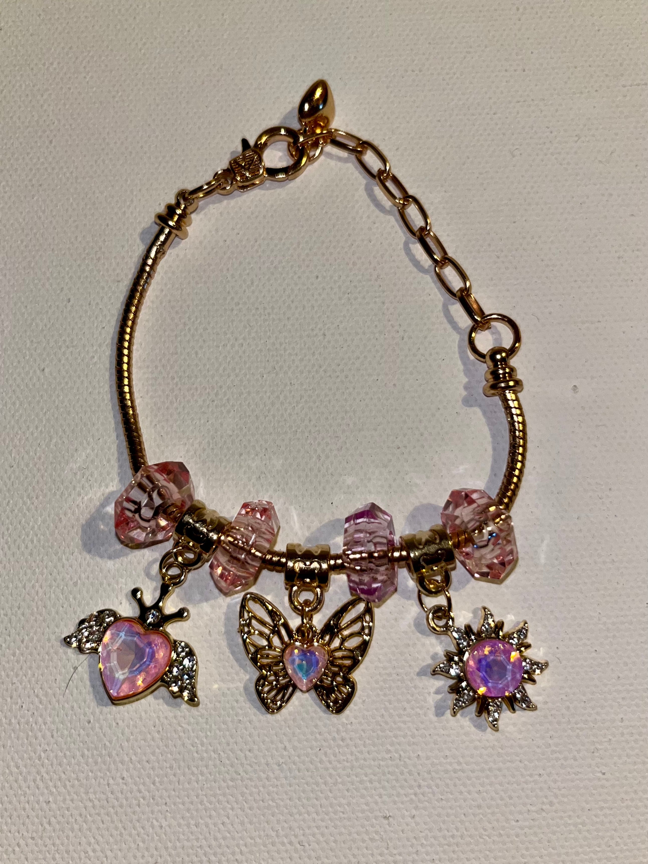 Gold-Tone Pink Crystal Charm Bracelet with Butterfly, Heart & Sun Charms