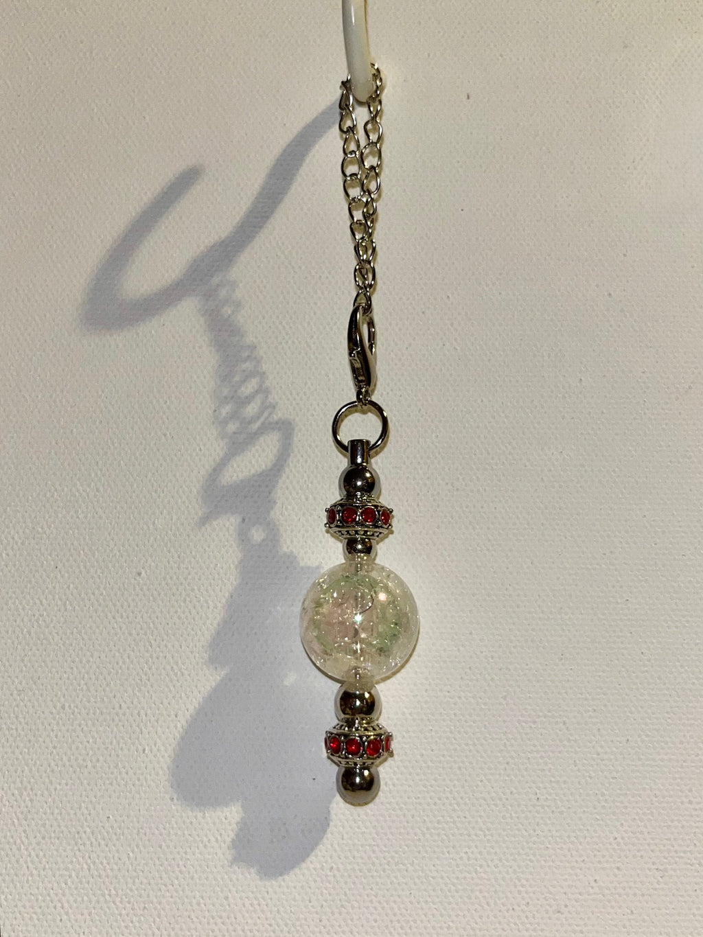 Cracked Iridescent Crystal Globe Keychain with Red Rhinestone Accent Detailing