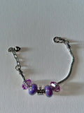 Silver Charm Bracelet with Purple Crystal Rondelle Beads and Crown Charm