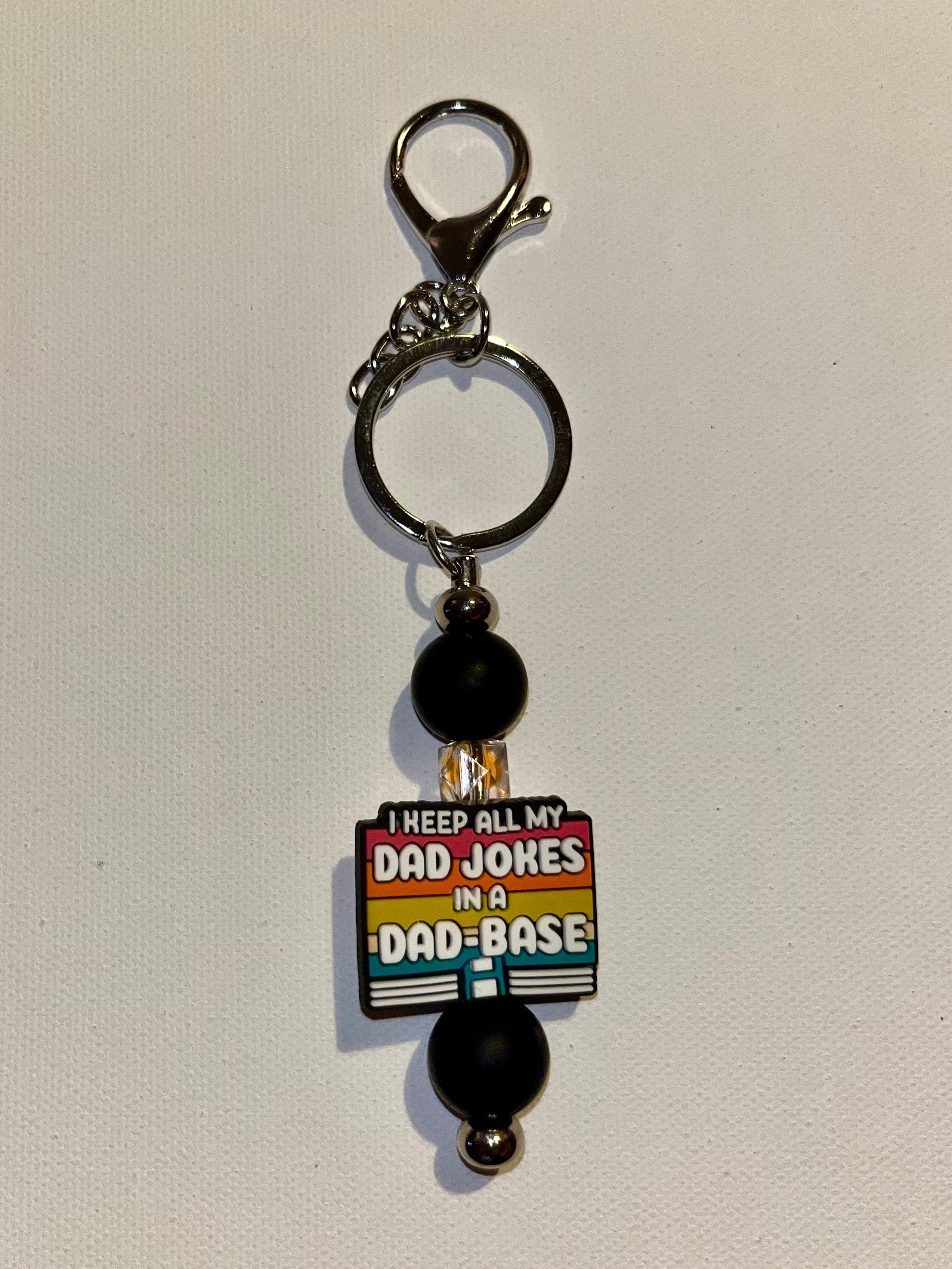 ‘I Keep All My Jokes in a Dad-Base’ Black with Retro Stripes Keychain