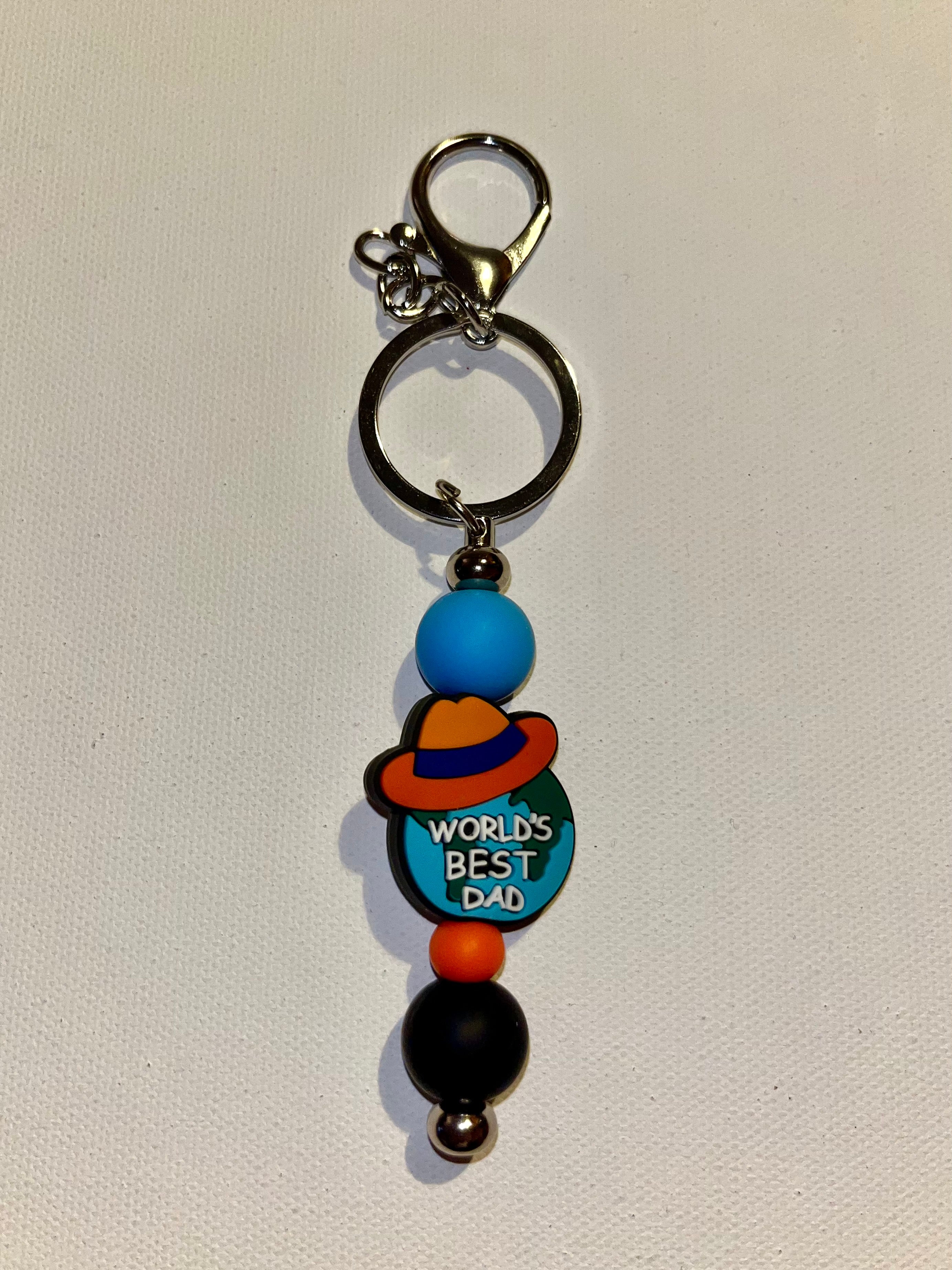 ‘World's Best Dad’ Globe w/Hat Charm Keychain in Blue, Orange & Black