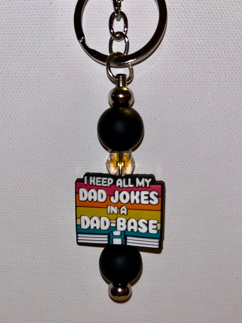 ‘I Keep All My Jokes in a Dad-Base’ Black with Retro Stripes Keychain